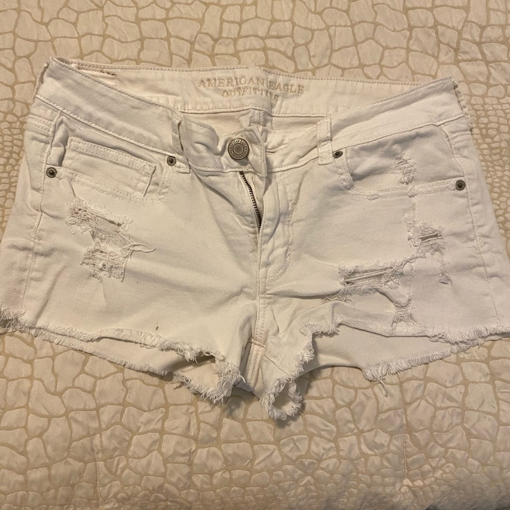 White distressed shorts